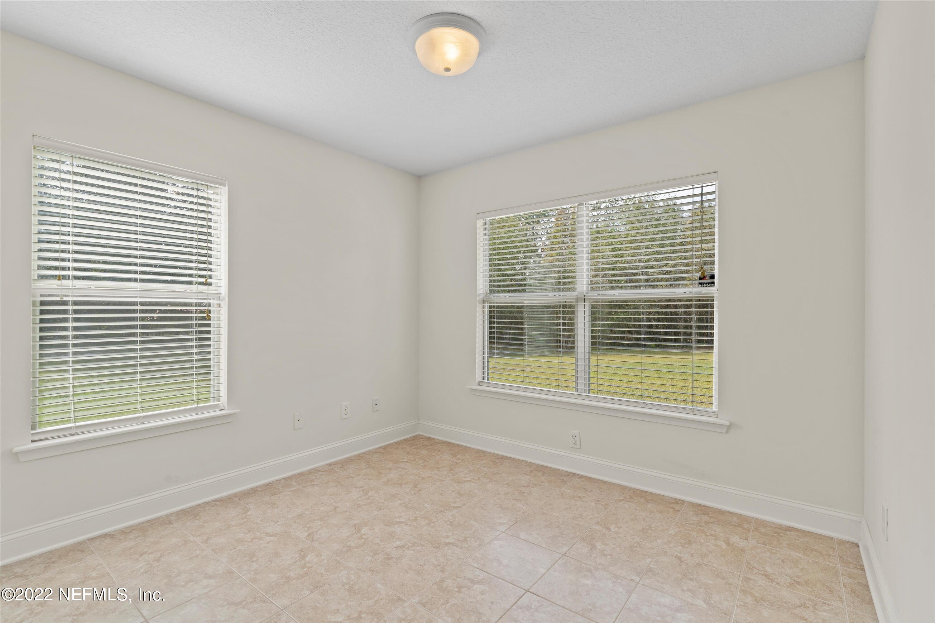 5306 Eulace Road Jacksonville, FL 32210 - Photo 11 of 30 a view of an empty room with a window