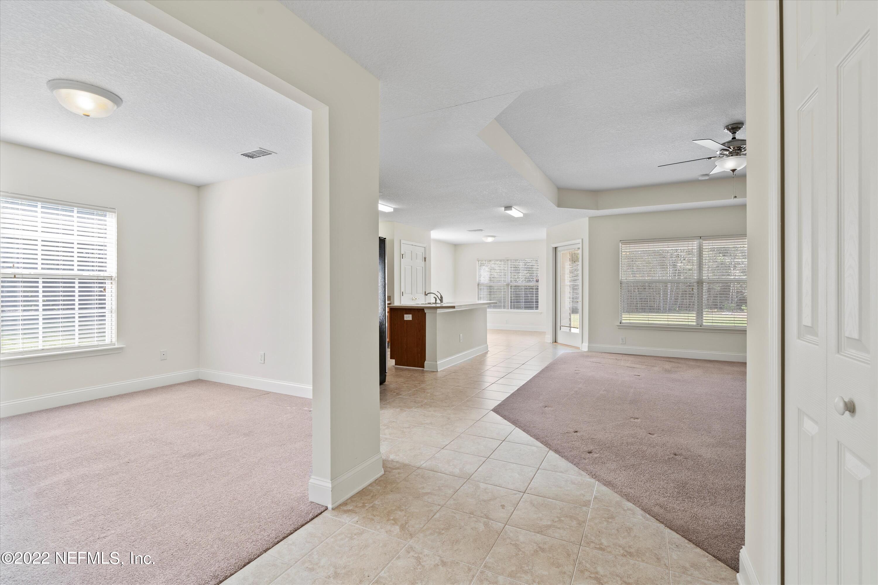 5306 Eulace Road Jacksonville, FL 32210 - Photo 2 of 30 a view of a hallway with furniture and a livingroom