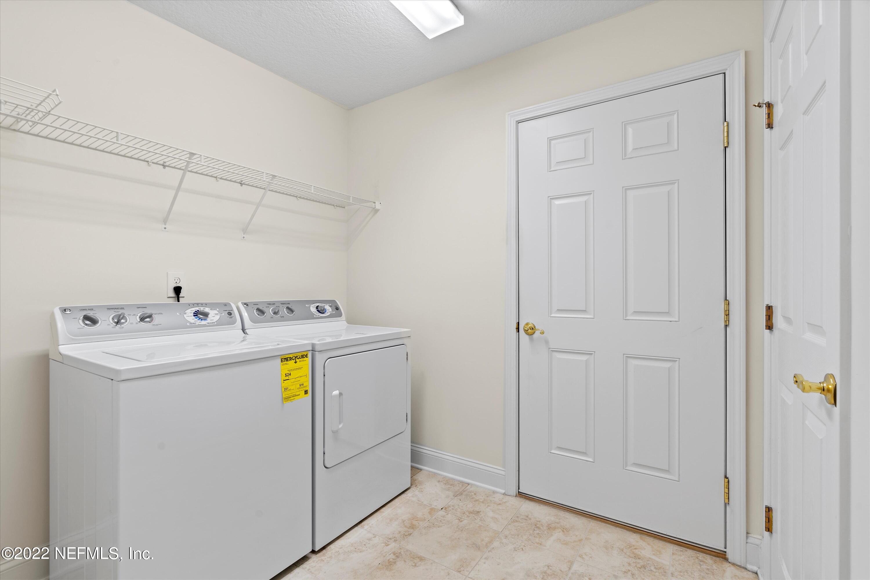 5306 Eulace Road Jacksonville, FL 32210 - Photo 21 of 30 a utility room with dryer and washer