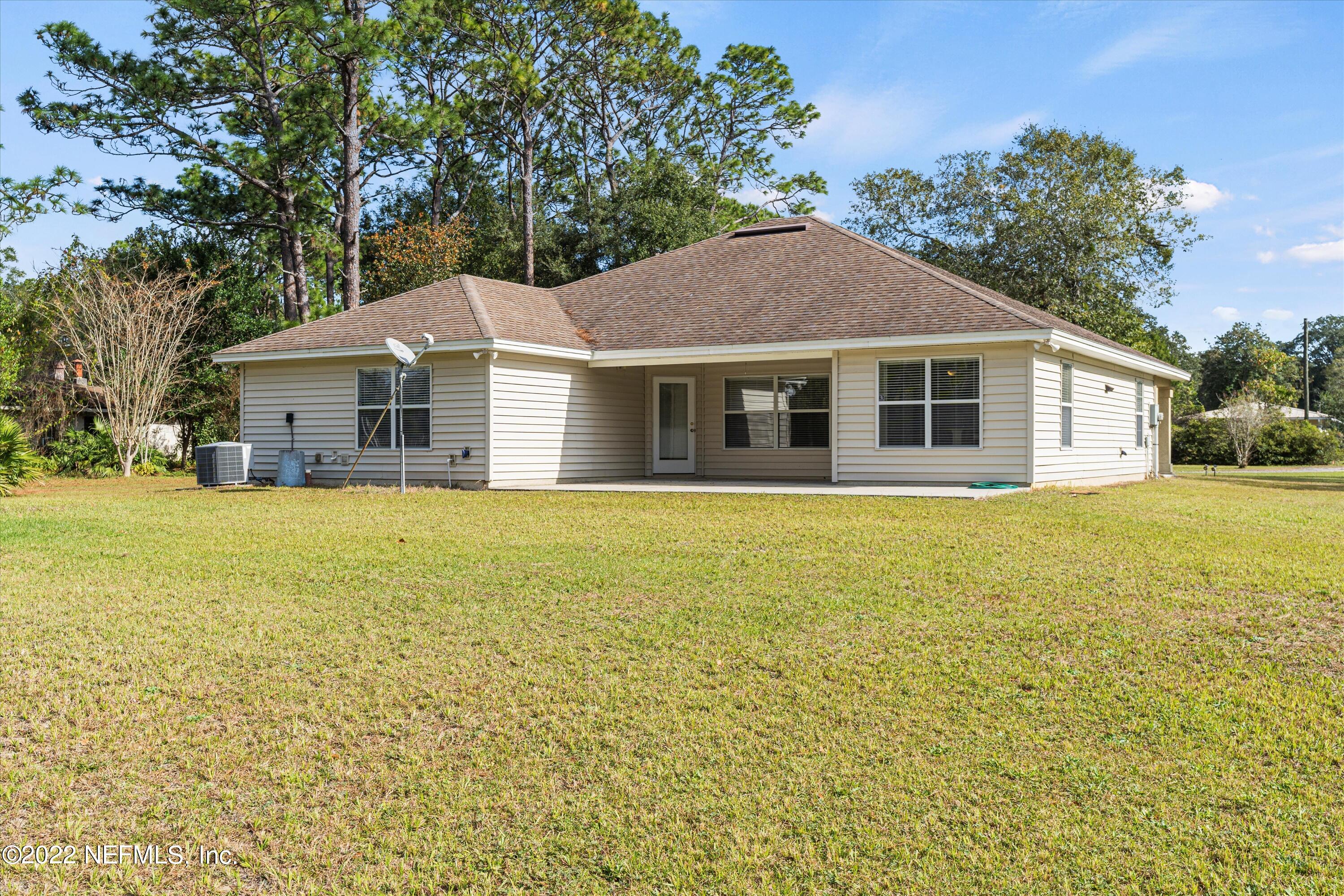 5306 Eulace Road Jacksonville, FL 32210 - Photo 23 of 30 a view of a house with a garden