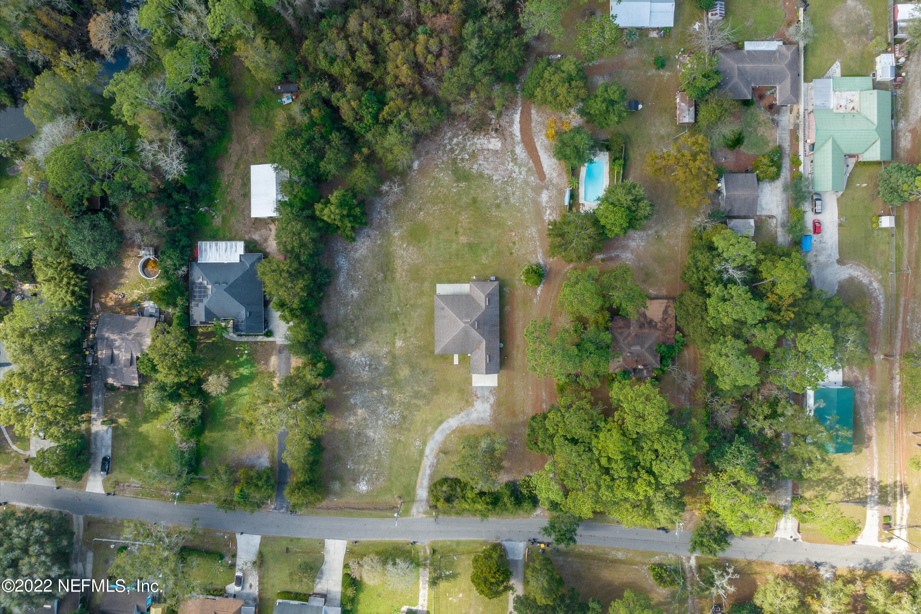 5306 Eulace Road Jacksonville, FL 32210 - Photo 29 of 30 an aerial view of residential houses with outdoor space