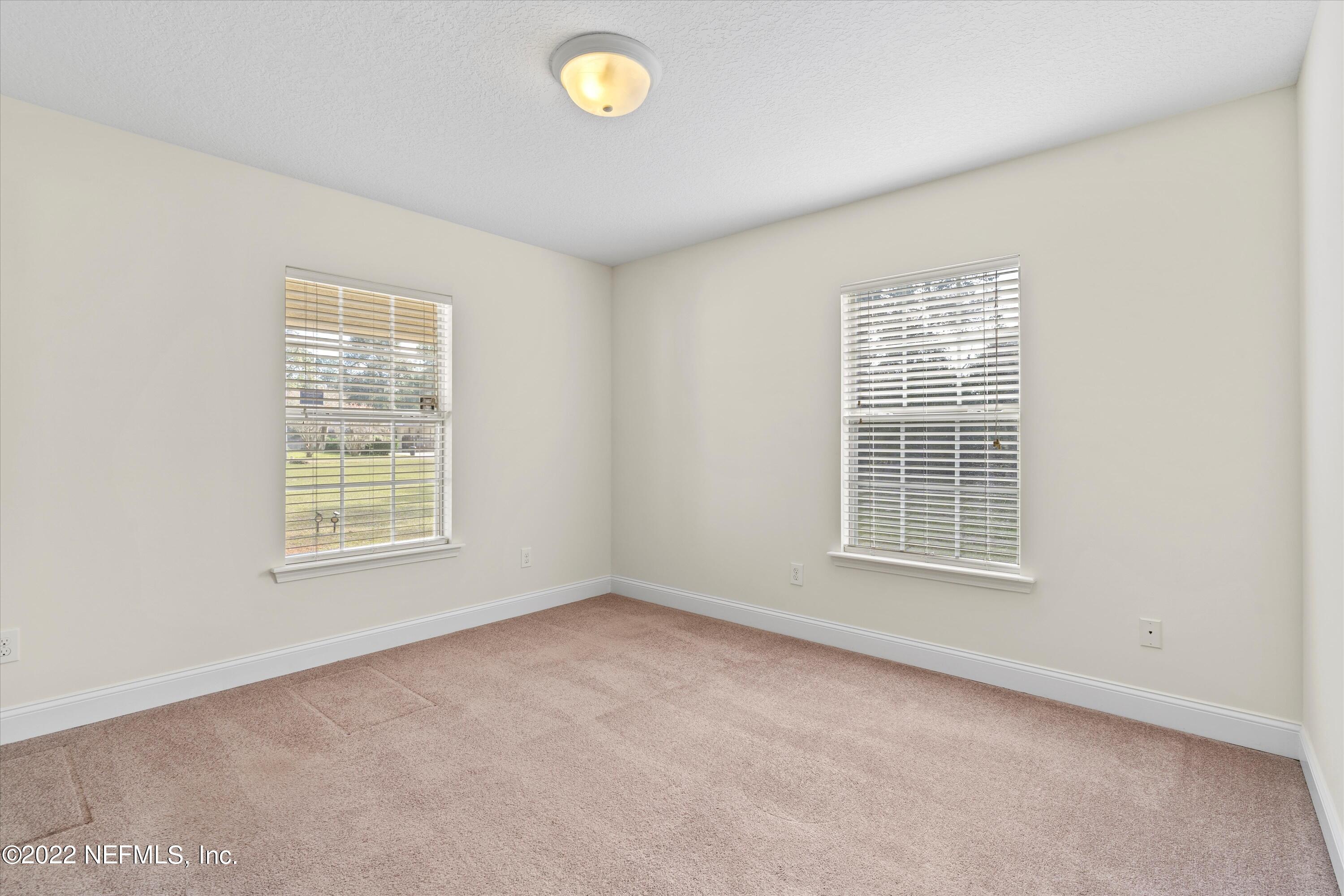 5306 Eulace Road Jacksonville, FL 32210 - Photo 3 of 30 an empty room with a window