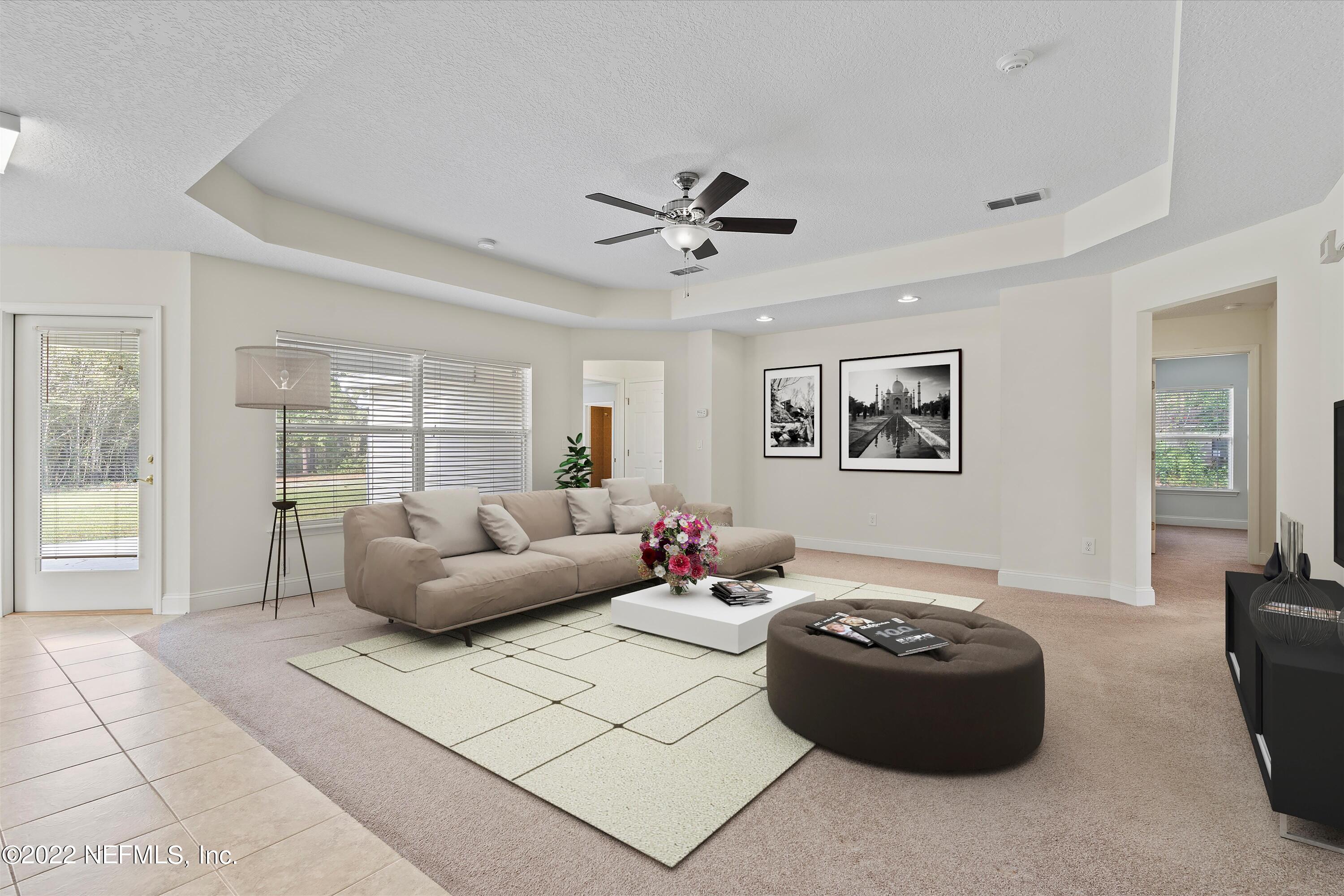 5306 Eulace Road Jacksonville, FL 32210 - Photo 6 of 30 a living room with furniture and a large window