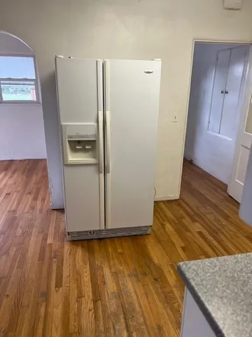 an empty room with wooden floor