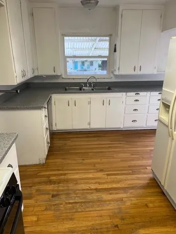 a view of cabinets and wooden floor