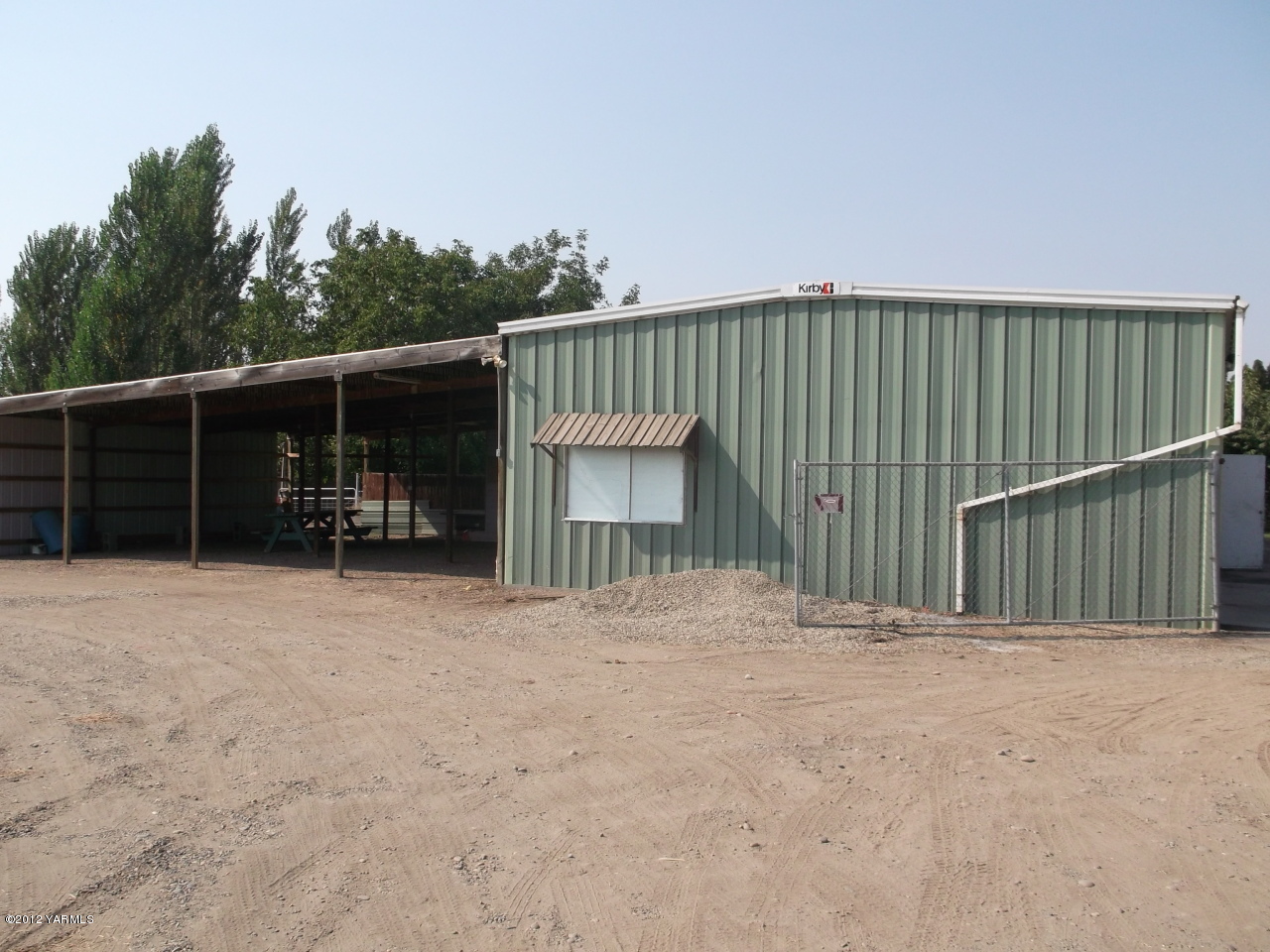 790 Murray Road Mabton, WA 98935 - Photo 11 of 18 a view of an house with backyard and chair