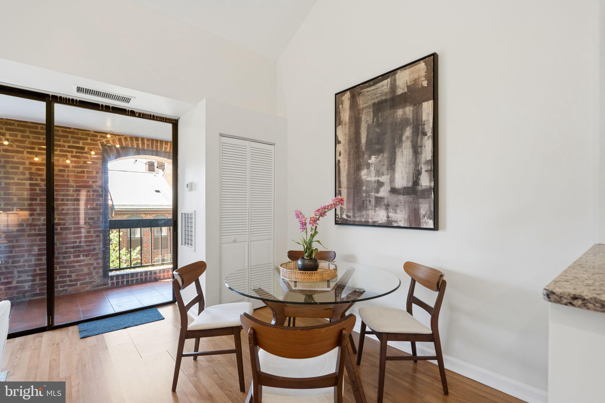 3225 Grace Street Northwest, Unit 226 Washington, DC 20007 - Photo 8 of 45 a dining room with furniture and window
