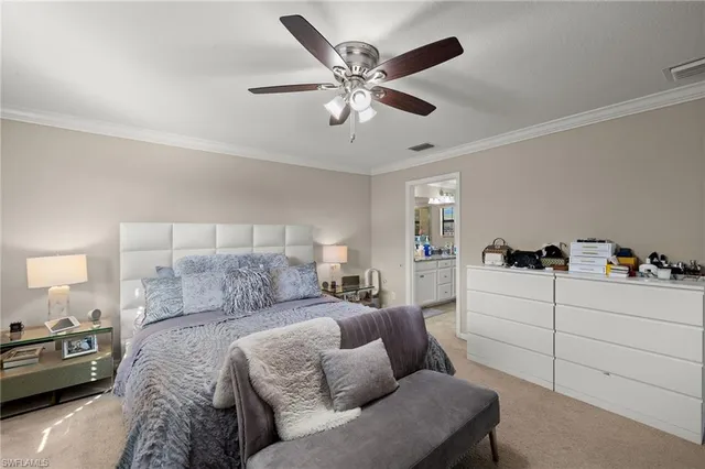 a bedroom with a bed and ceiling fan