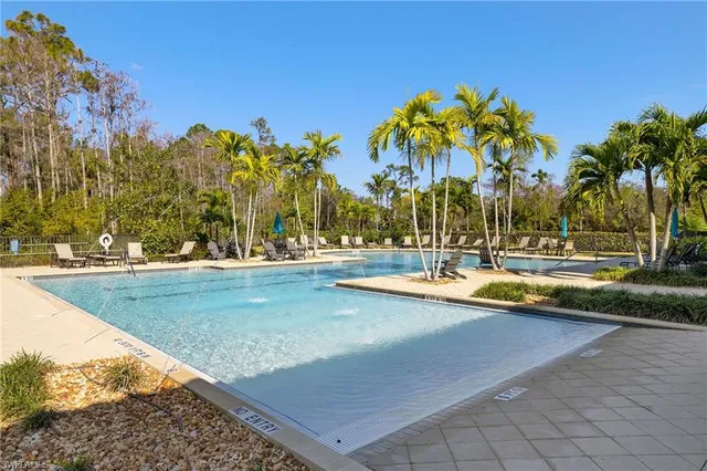 a view of outdoor space with swimming pool and lounge chair