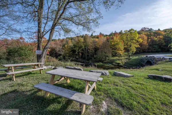 a view of a backyard with sitting area