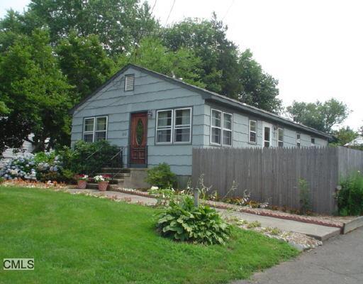 202 Meadows End Road Milford, CT 06460 - Photo 1 of 1 a backyard of a house with a garden and plants