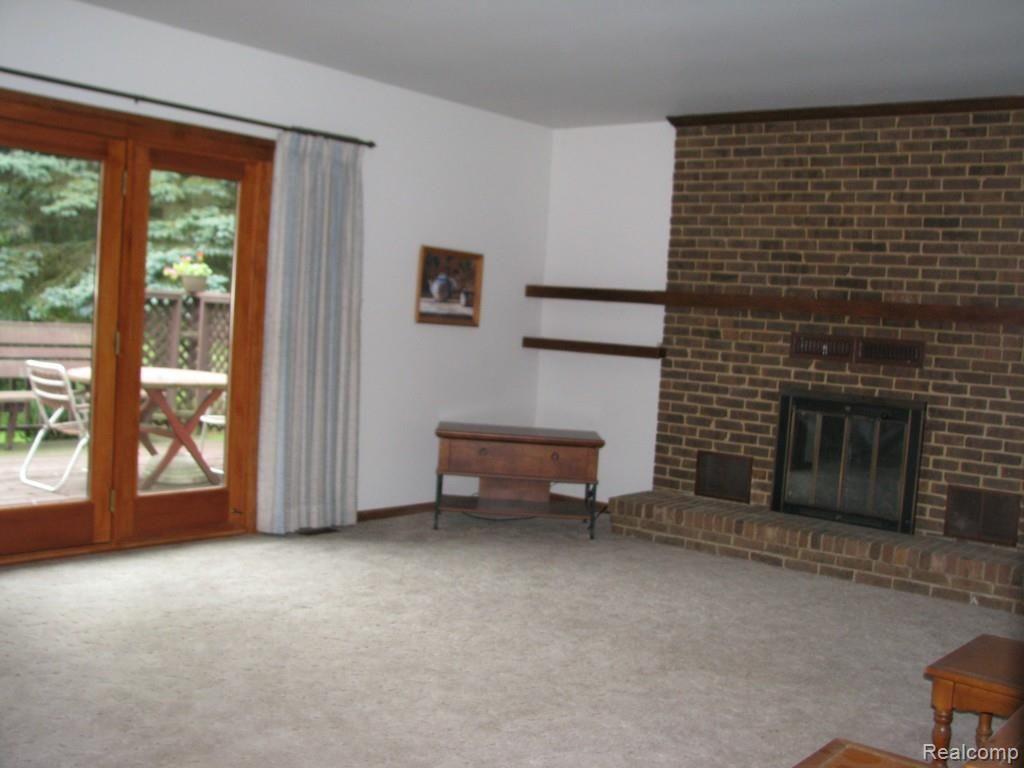 9334 Hilton Road Brighton, MI 48114 - Photo 19 of 34 Additional view family room showing Pella doorway leading to the back yard deck