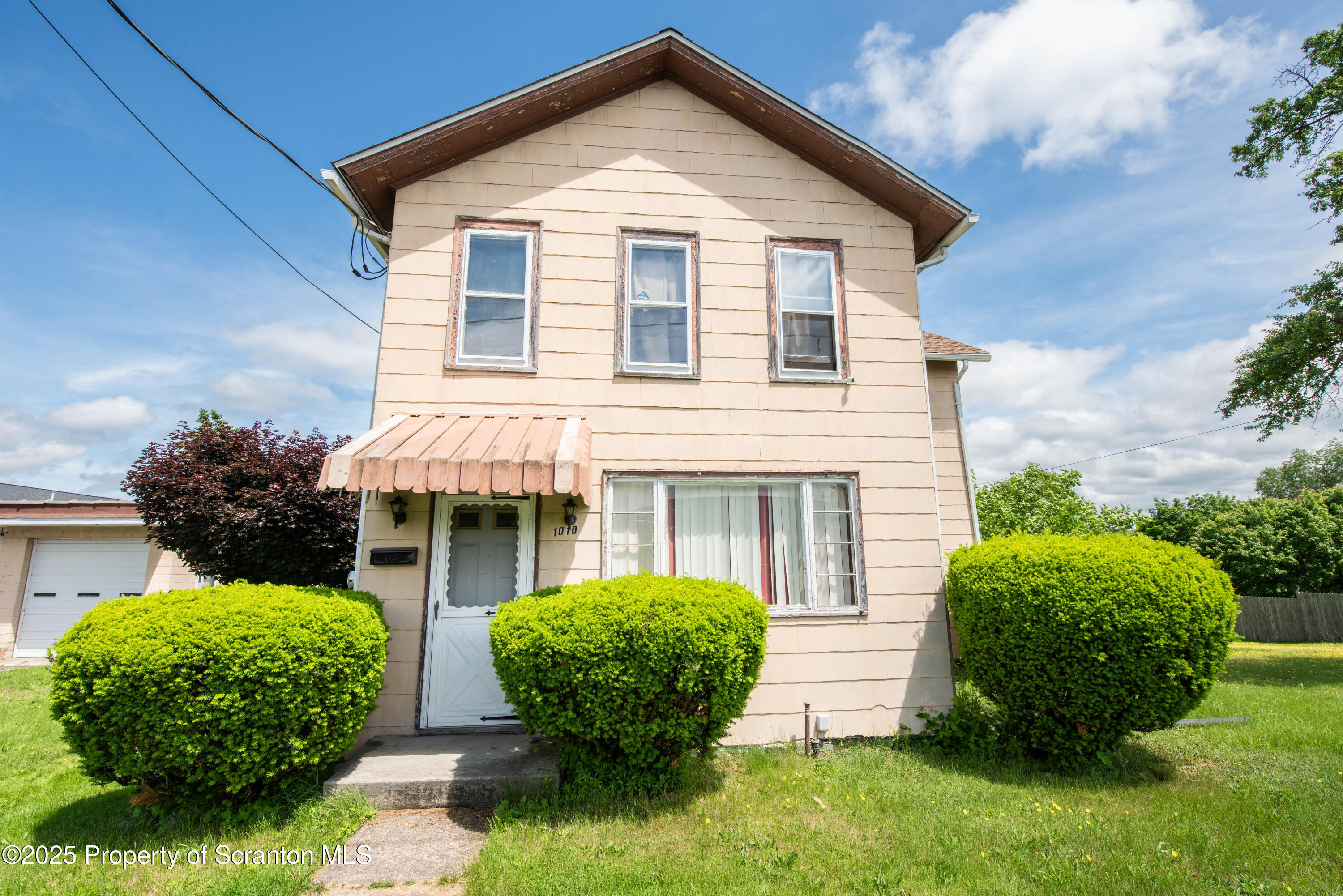 1010 Wood Street Old Forge, PA 18518 - Photo 1 of 38 a view of an house with backyard space and garden