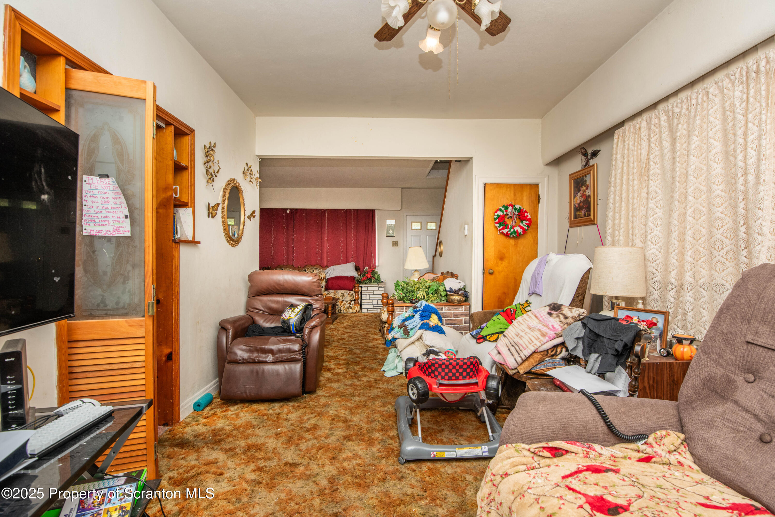 1010 Wood Street Old Forge, PA 18518 - Photo 17 of 38 a bed room with furniture and a window