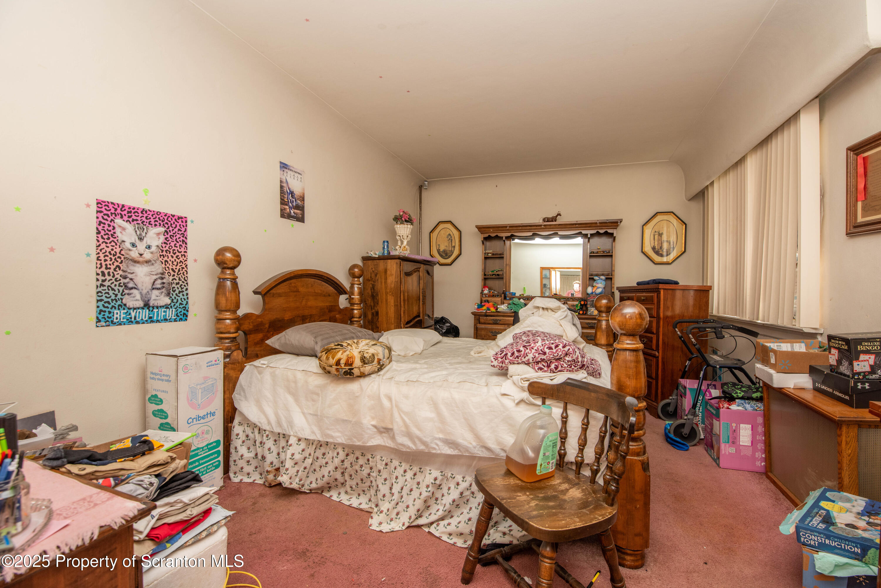 1010 Wood Street Old Forge, PA 18518 - Photo 25 of 38 a bedroom with bed and a chair