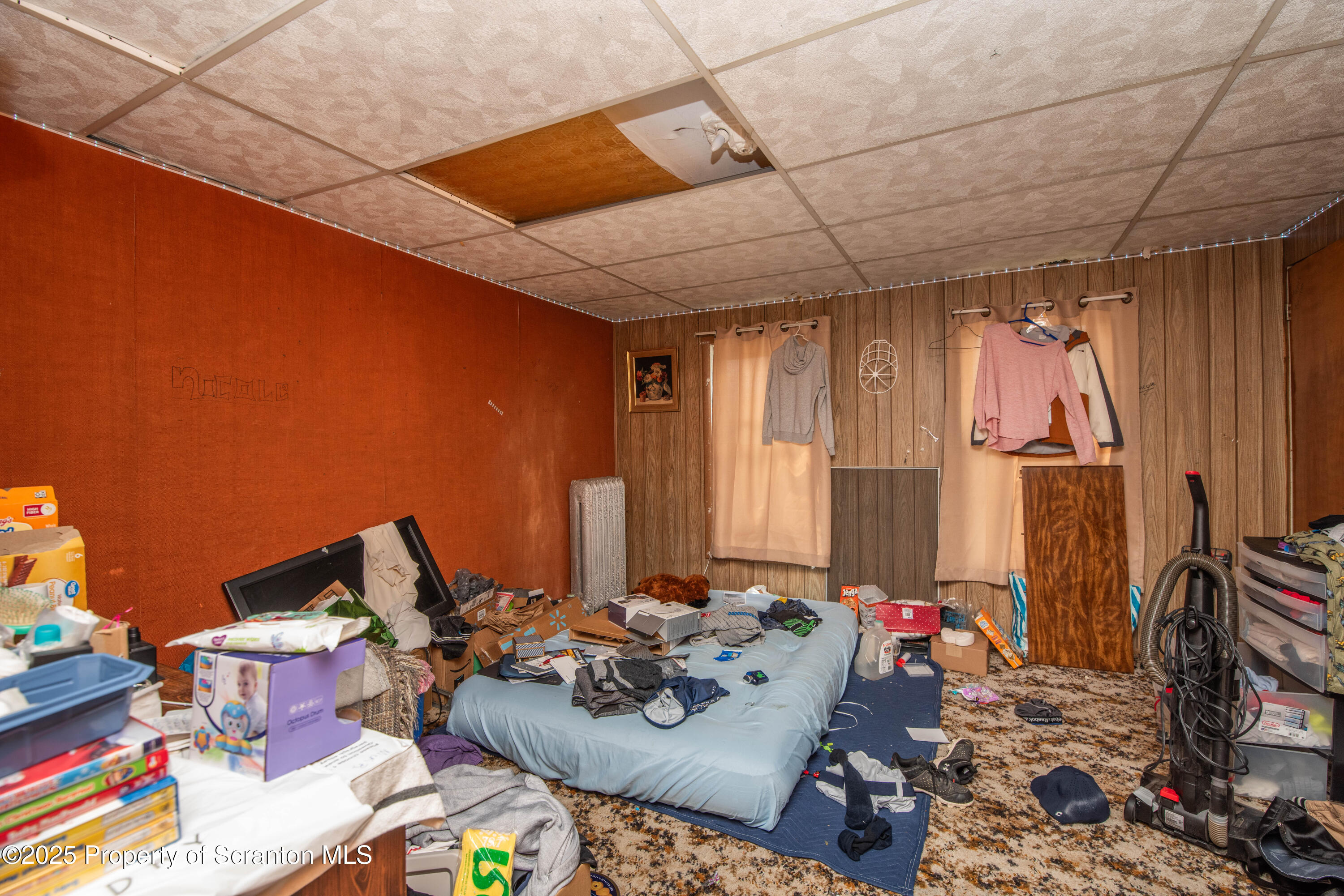 1010 Wood Street Old Forge, PA 18518 - Photo 26 of 38 a living room with furniture and a flat screen tv