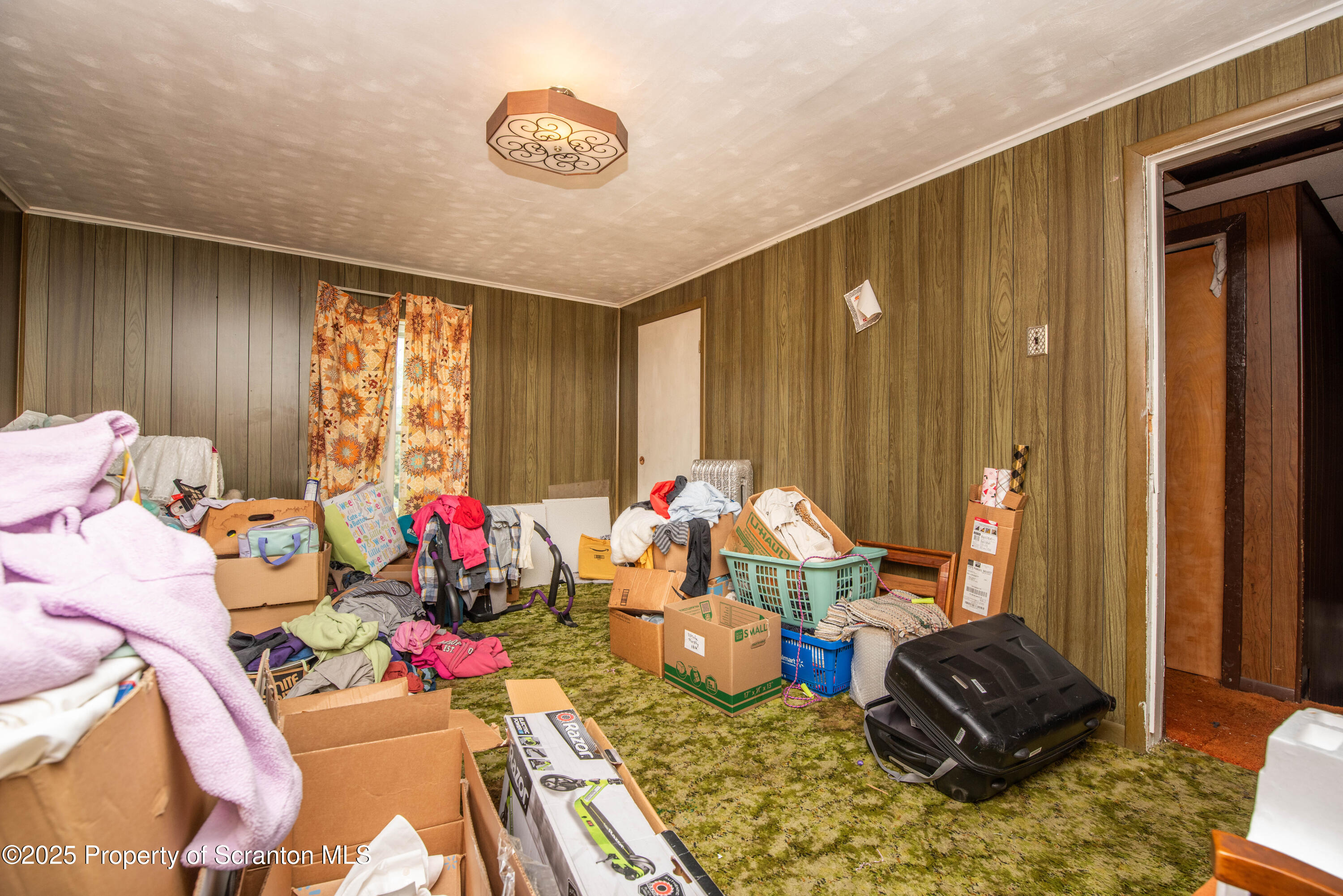 1010 Wood Street Old Forge, PA 18518 - Photo 29 of 38 a living room with furniture and a window
