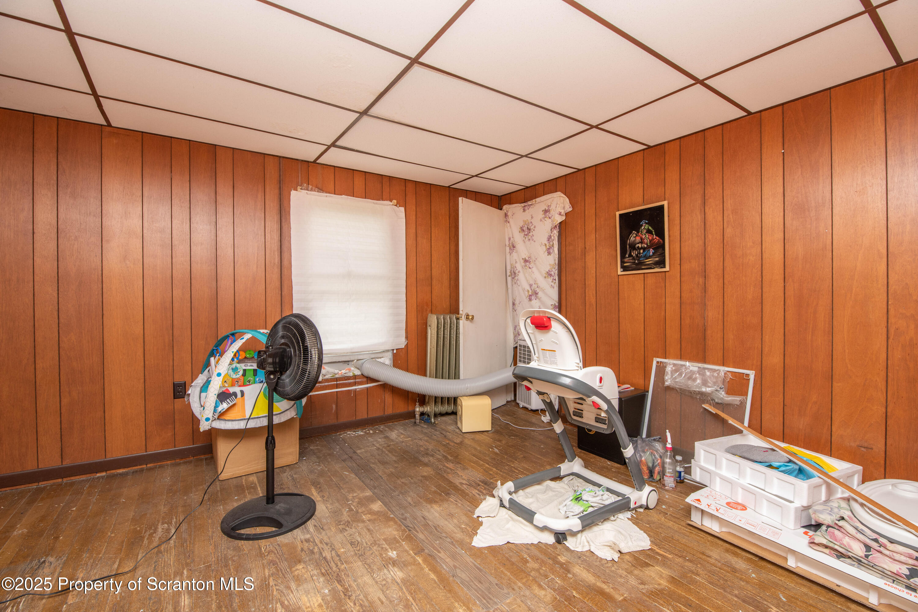 1010 Wood Street Old Forge, PA 18518 - Photo 32 of 38 a work room with furniture and wooden floor