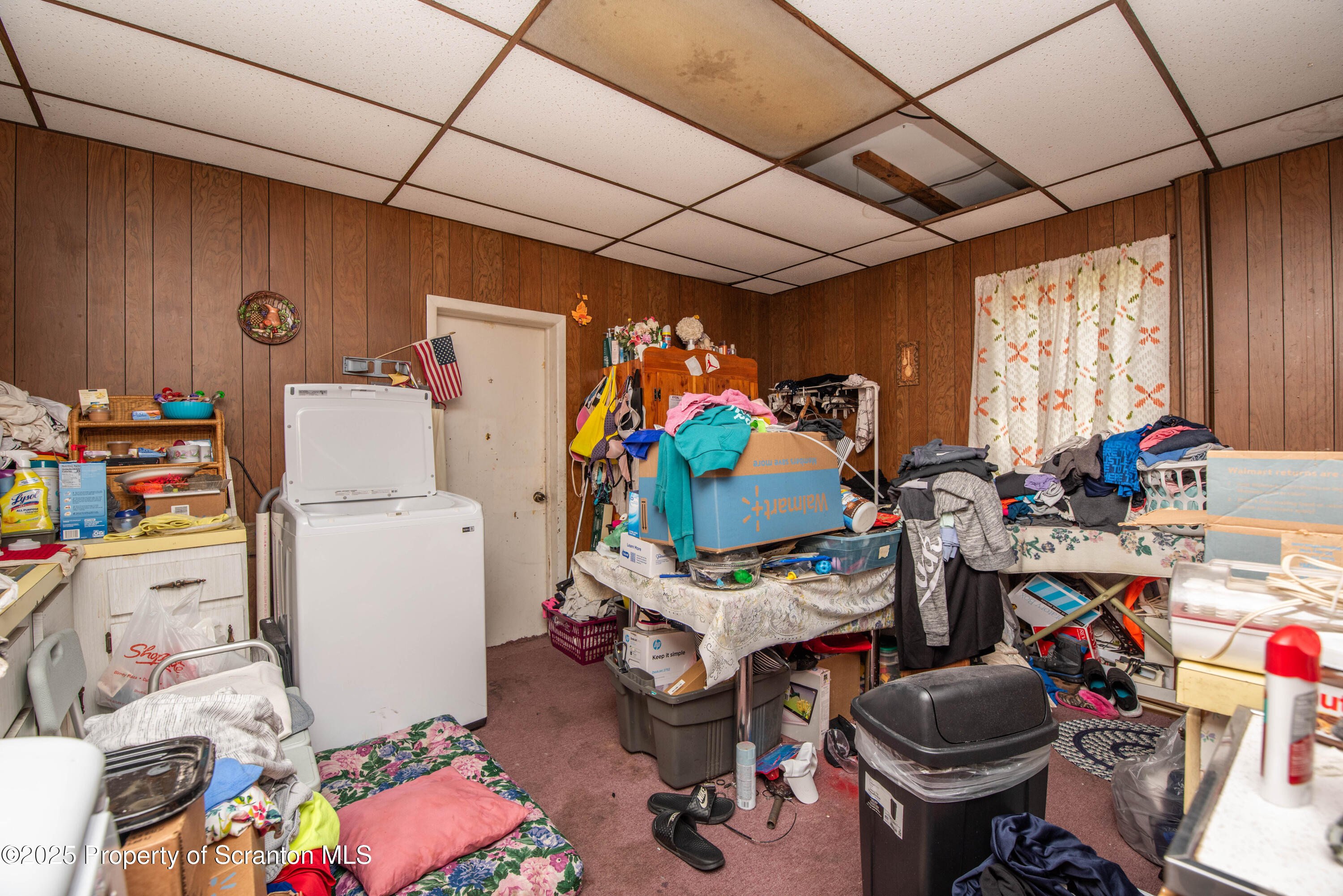 1010 Wood Street Old Forge, PA 18518 - Photo 34 of 38 a room with furniture a chandelier and a window