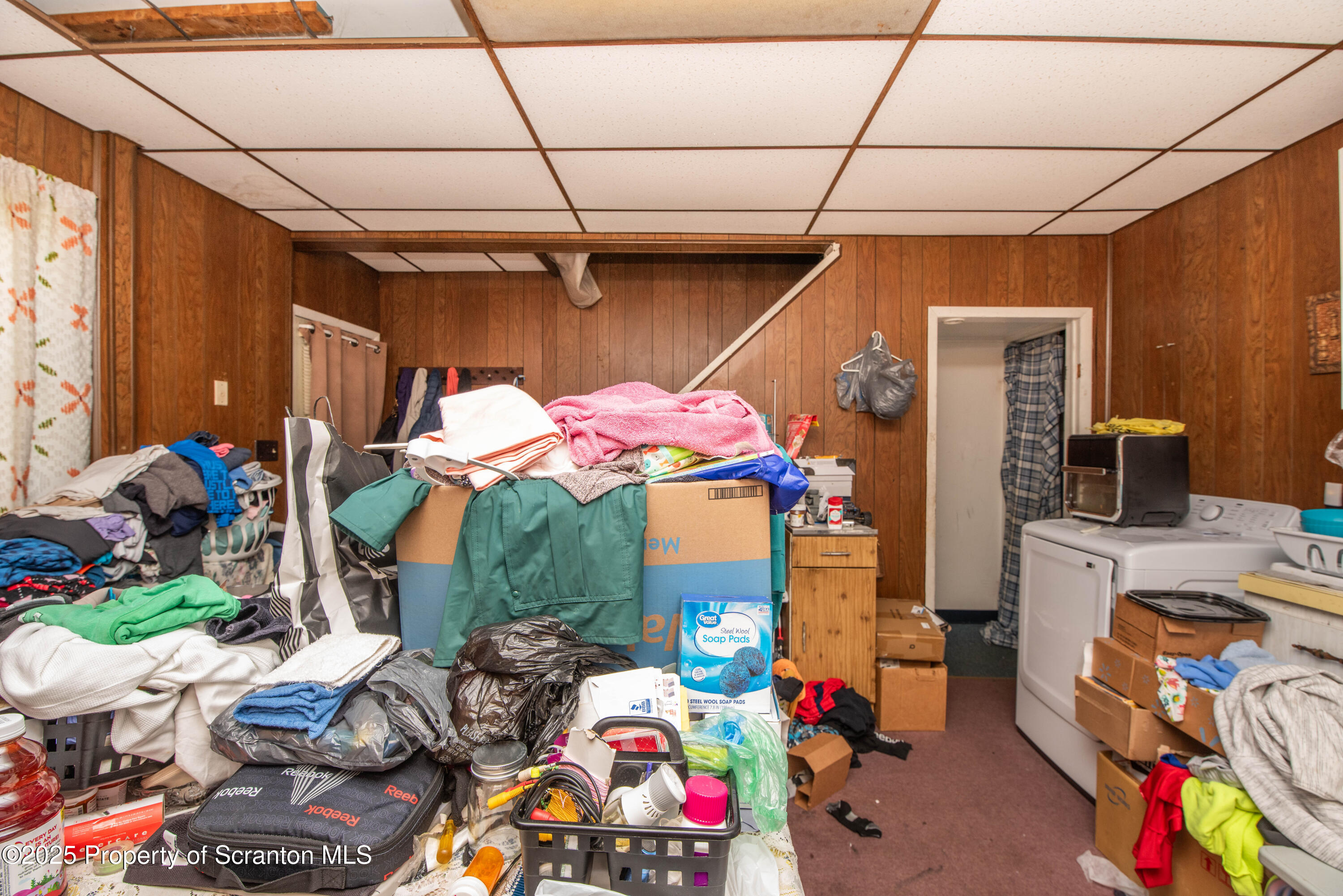 1010 Wood Street Old Forge, PA 18518 - Photo 36 of 38 a room filled with furniture and a flat screen tv