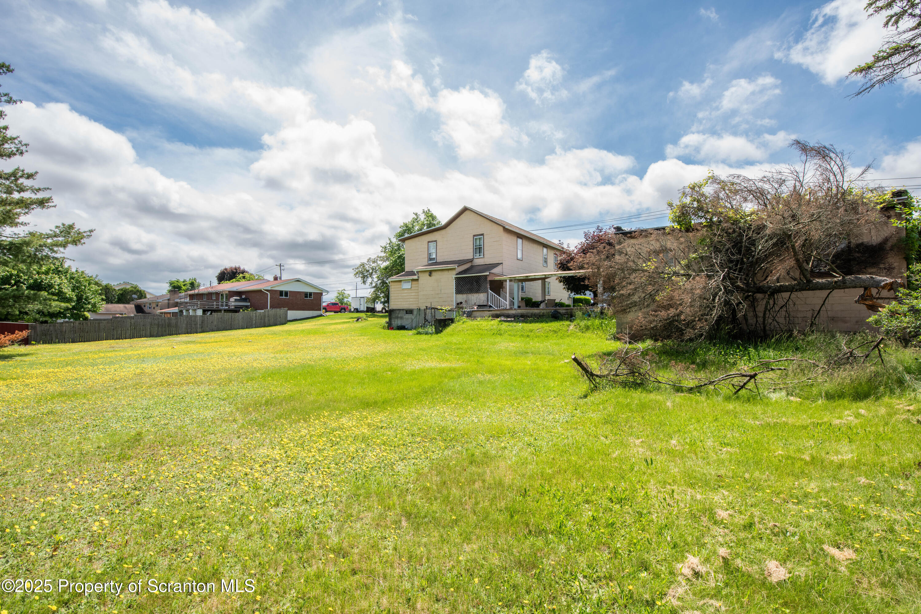 1010 Wood Street Old Forge, PA 18518 - Photo 4 of 38 a view of a lake with table and chairs
