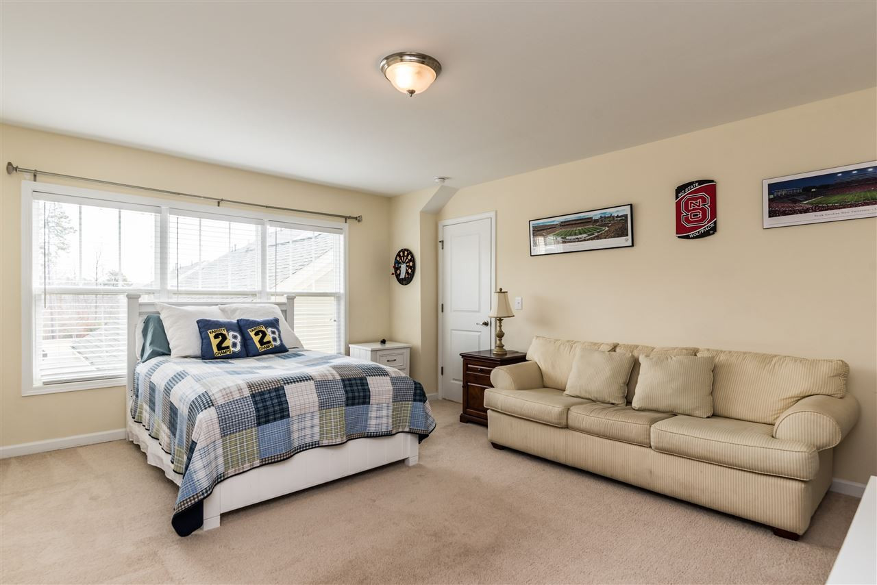 1413 Van Page Boulevard Raleigh, NC 27607 - Photo 23 of 25 ENJOY THIS FINISHED GARAGE BONUS ROOM FOR A HANG OUT SPACE OR AN EXTRA BEDROOM OR A HOME OFFICE. GARAGE BONUS ROOM
