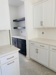 3432 Desinda Drive Murfreesboro, TN 37129 - Photo 4 of 15 a kitchen with white cabinets and sink
