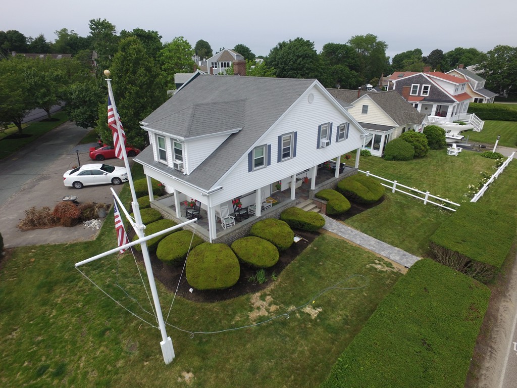 65 Jericho Road Scituate, MA 02066 - Photo 1 of 26 an aerial view of residential houses with outdoor space and trees