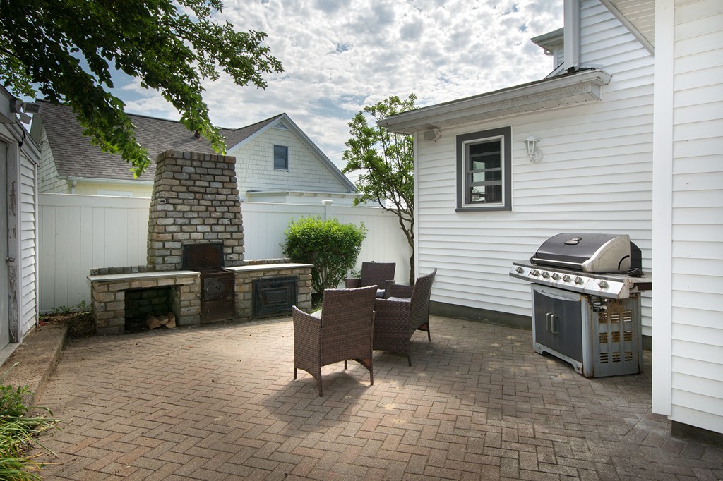 65 Jericho Road Scituate, MA 02066 - Photo 11 of 26 a backyard of a house with seating space