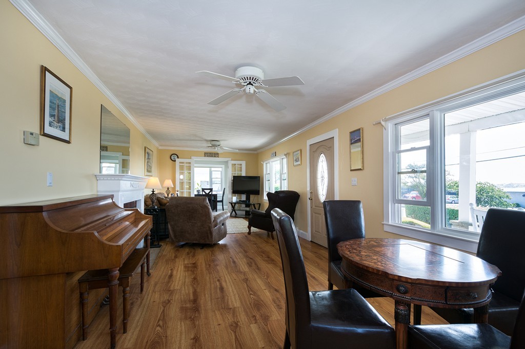 65 Jericho Road Scituate, MA 02066 - Photo 16 of 26 a view of a dining room with furniture window and wooden floor