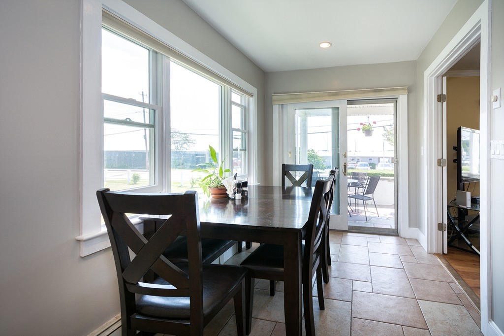 65 Jericho Road Scituate, MA 02066 - Photo 18 of 26 a dining room with furniture a chandelier and wooden floor