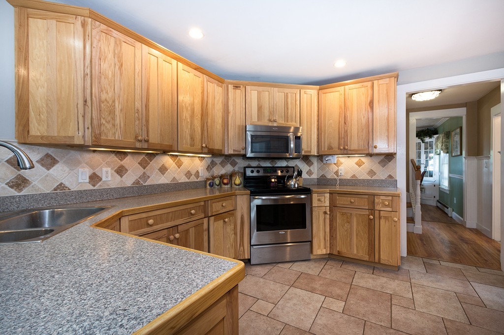 65 Jericho Road Scituate, MA 02066 - Photo 19 of 26 a kitchen with granite countertop a stove sink and cabinets