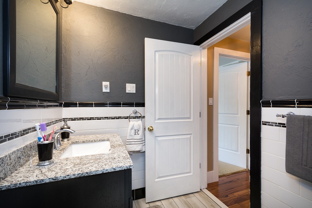 65 Jericho Road Scituate, MA 02066 - Photo 22 of 26 a bathroom with a granite countertop sink and a mirror