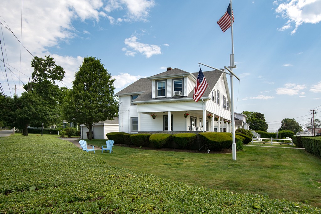 65 Jericho Road Scituate, MA 02066 - Photo 5 of 26 a front view of a house with a garden
