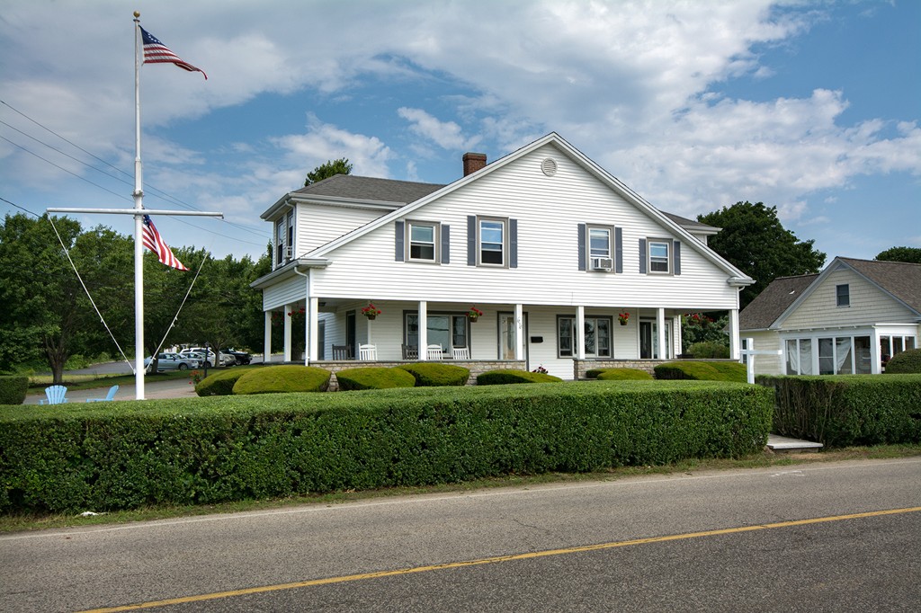 65 Jericho Road Scituate, MA 02066 - Photo 6 of 26 a front view of a house with a yard
