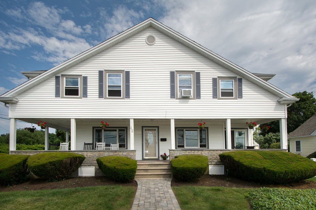 65 Jericho Road Scituate, MA 02066 - Photo 7 of 26 a front view of a house with porch and outdoor seating