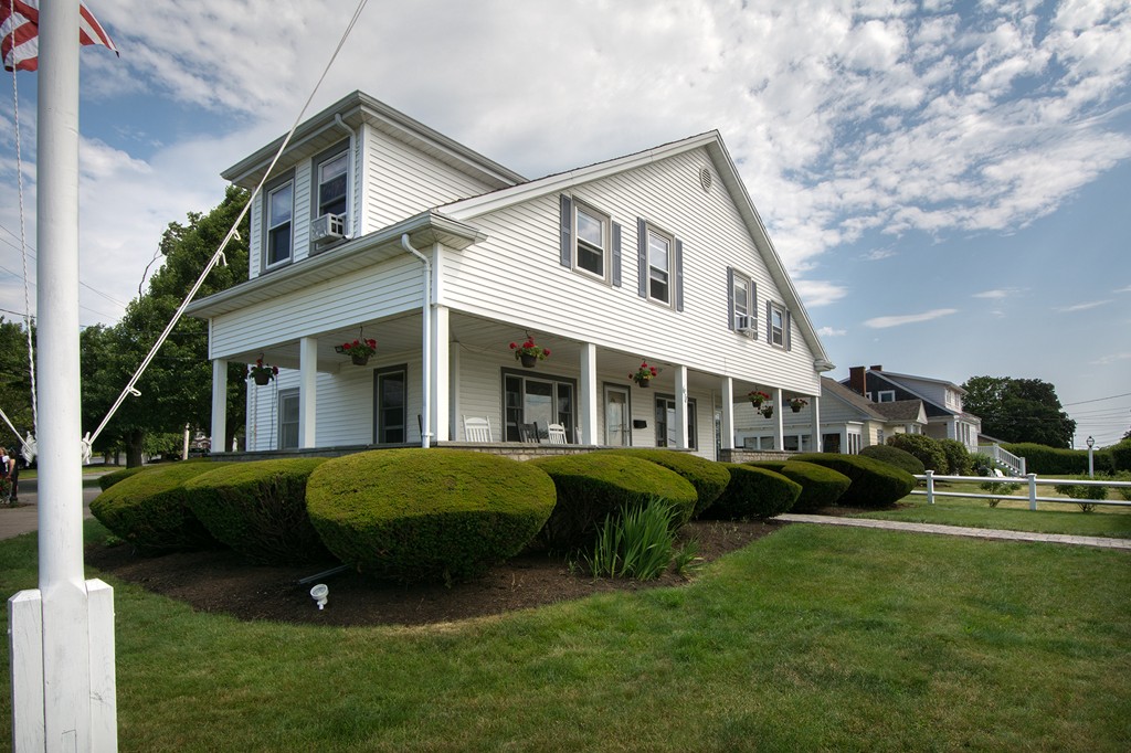 65 Jericho Road Scituate, MA 02066 - Photo 9 of 26 a front view of a house with a garden