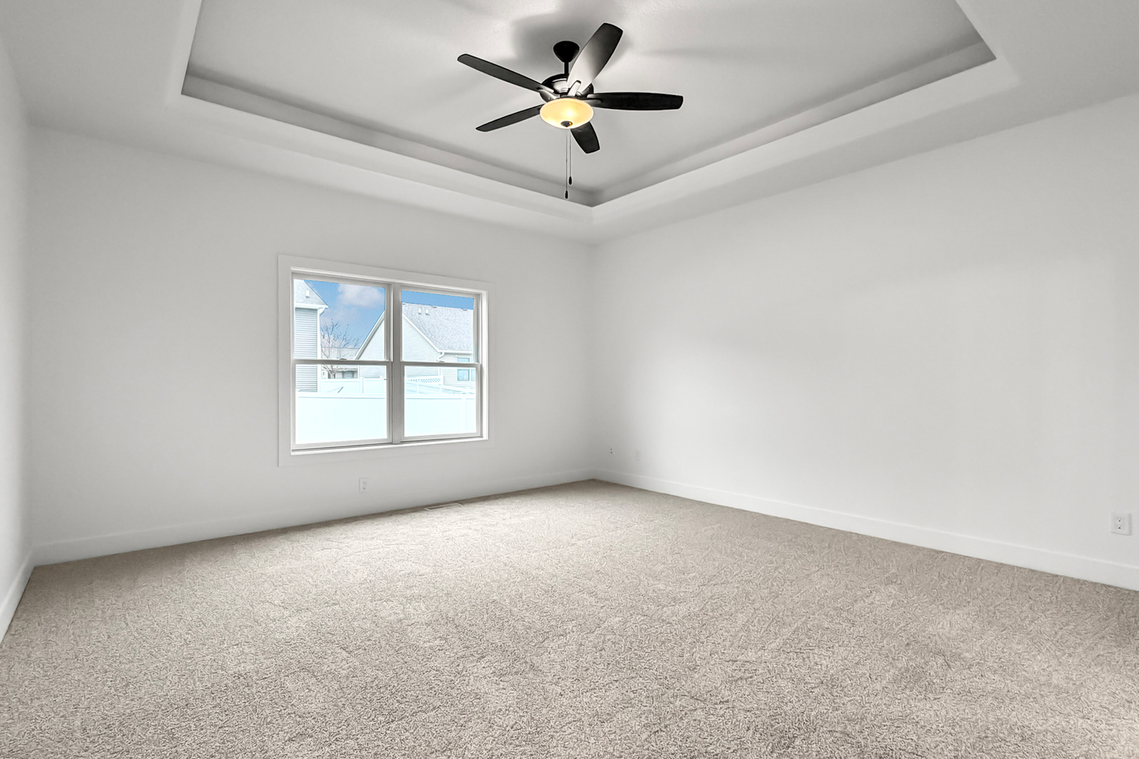 606 Kevin Road Blue Grass, IA 52726 - Photo 29 of 33 an empty room with a window and a ceiling fan