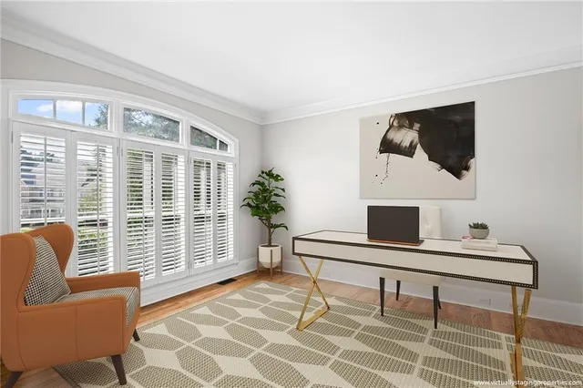 a view of a livingroom with a ceiling fan and window