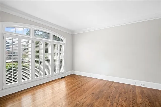 a bathroom with a granite countertop double vanity sink a vanity and a mirror