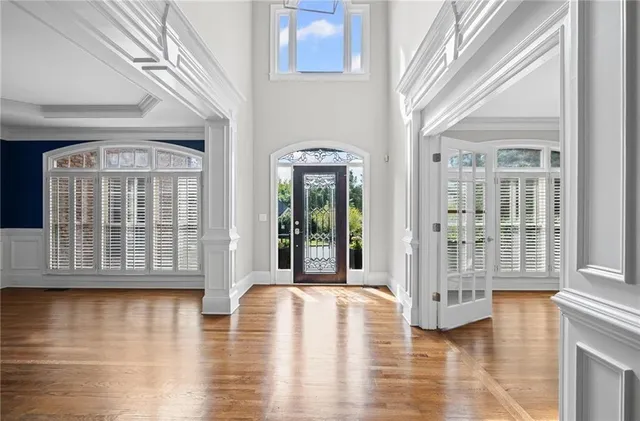 a view of kitchen with wooden floor and windows