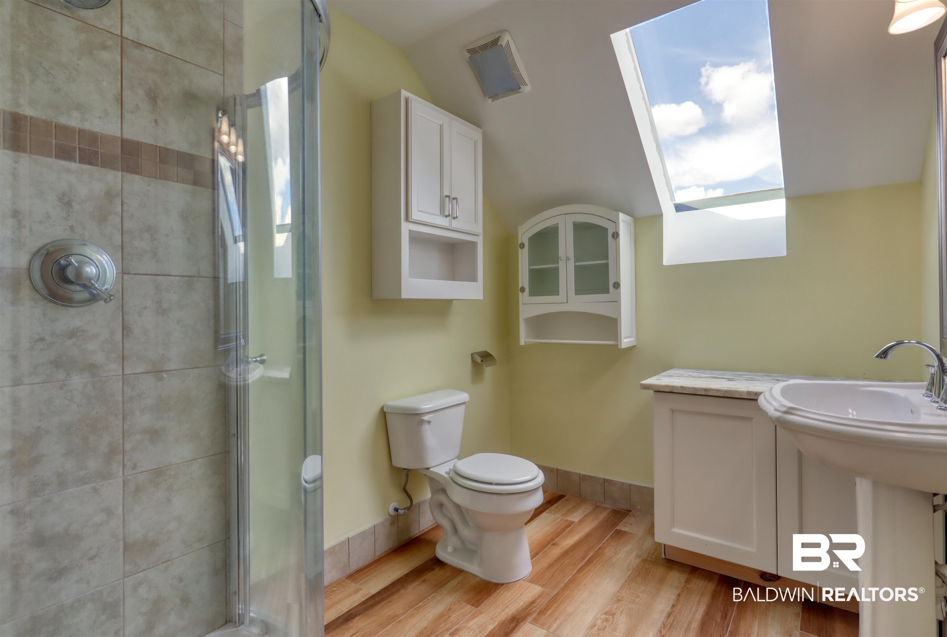 28461 Gardner Road Elberta, AL 36530 - Photo 24 of 46 Bathroom with a stall shower and light wood-style floors