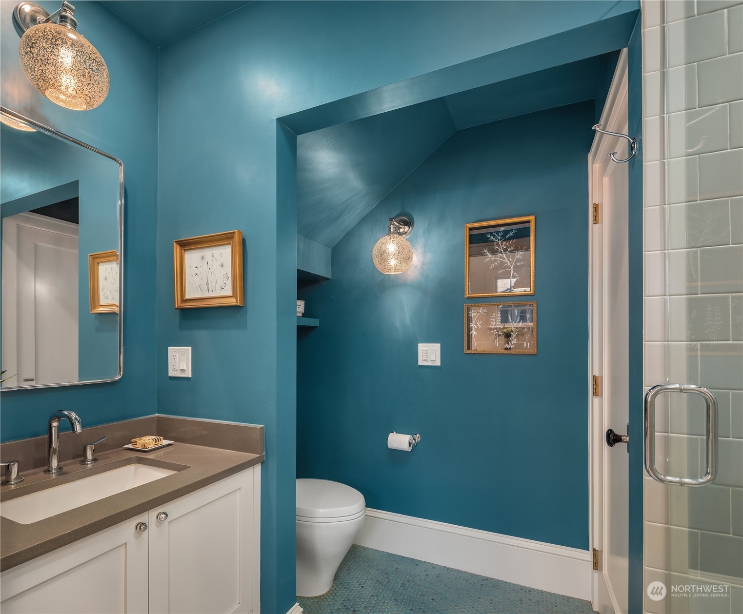 2536 1st Avenue West Seattle, WA 98119 - Photo 14 of 27 a bathroom with a toilet sink and mirror