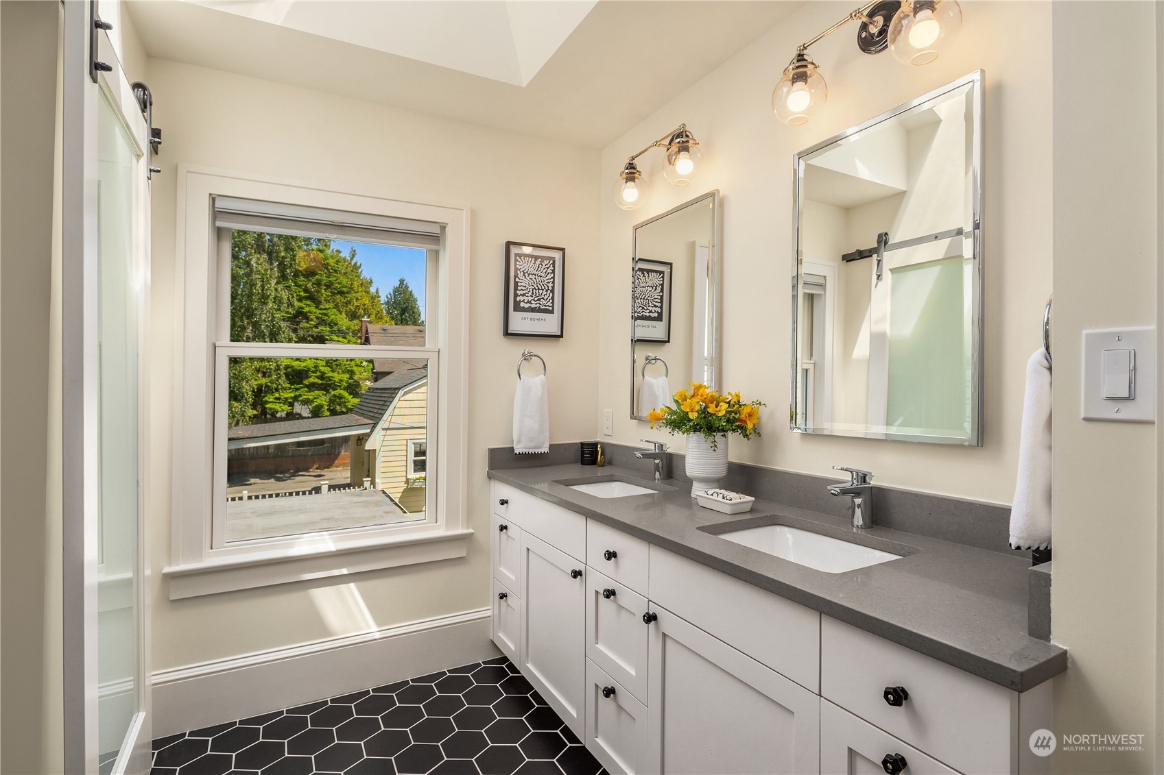2536 1st Avenue West Seattle, WA 98119 - Photo 17 of 27 a bathroom with a granite countertop sink and a window