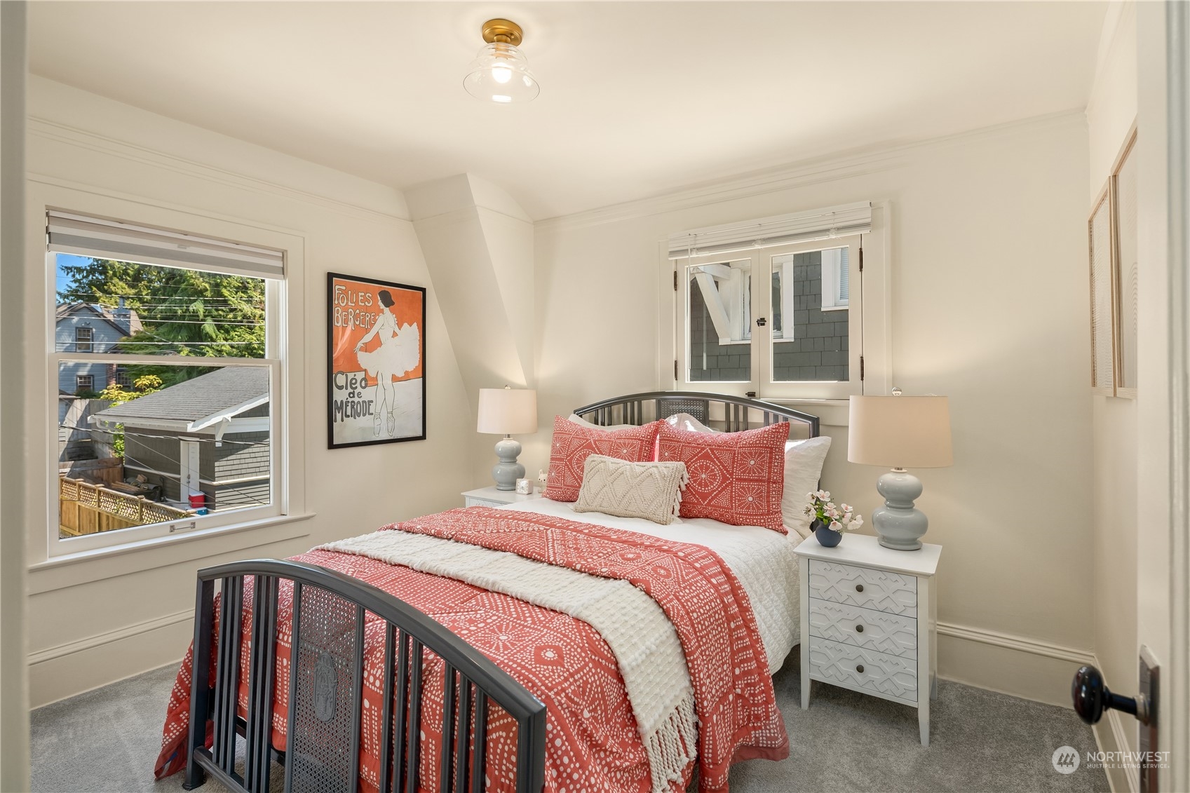2536 1st Avenue West Seattle, WA 98119 - Photo 19 of 27 a bedroom with a bed and a window