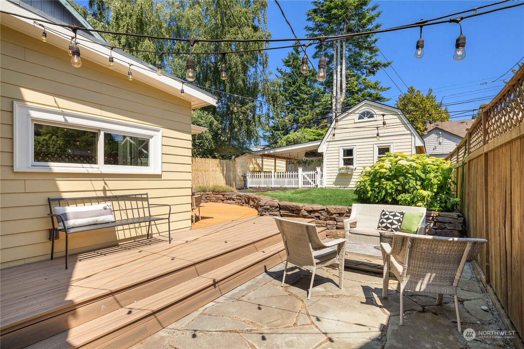 2536 1st Avenue West Seattle, WA 98119 - Photo 23 of 27 a view of a patio with table and chairs and potted plants