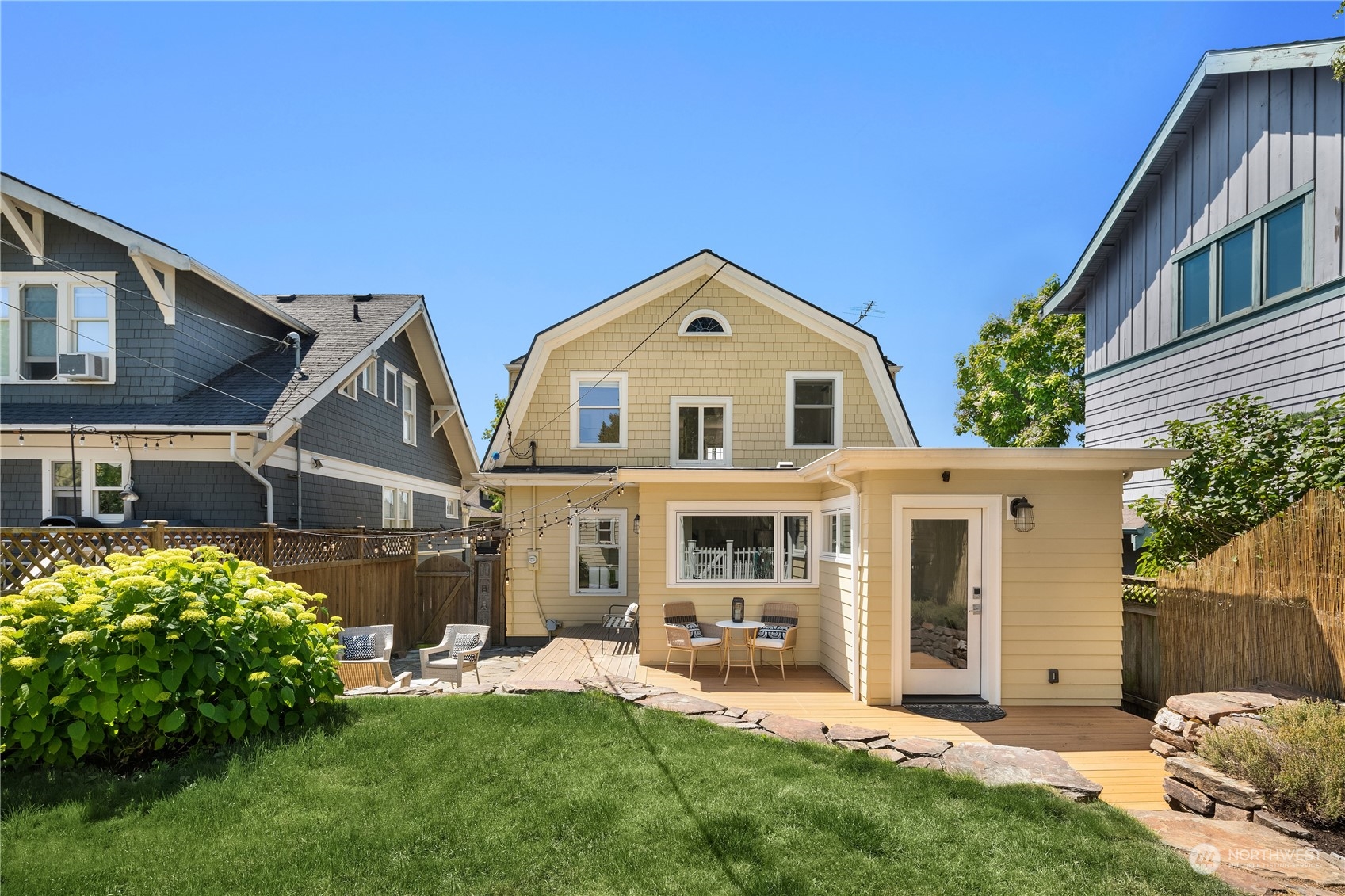 2536 1st Avenue West Seattle, WA 98119 - Photo 24 of 27 a front view of a house with a yard and porch