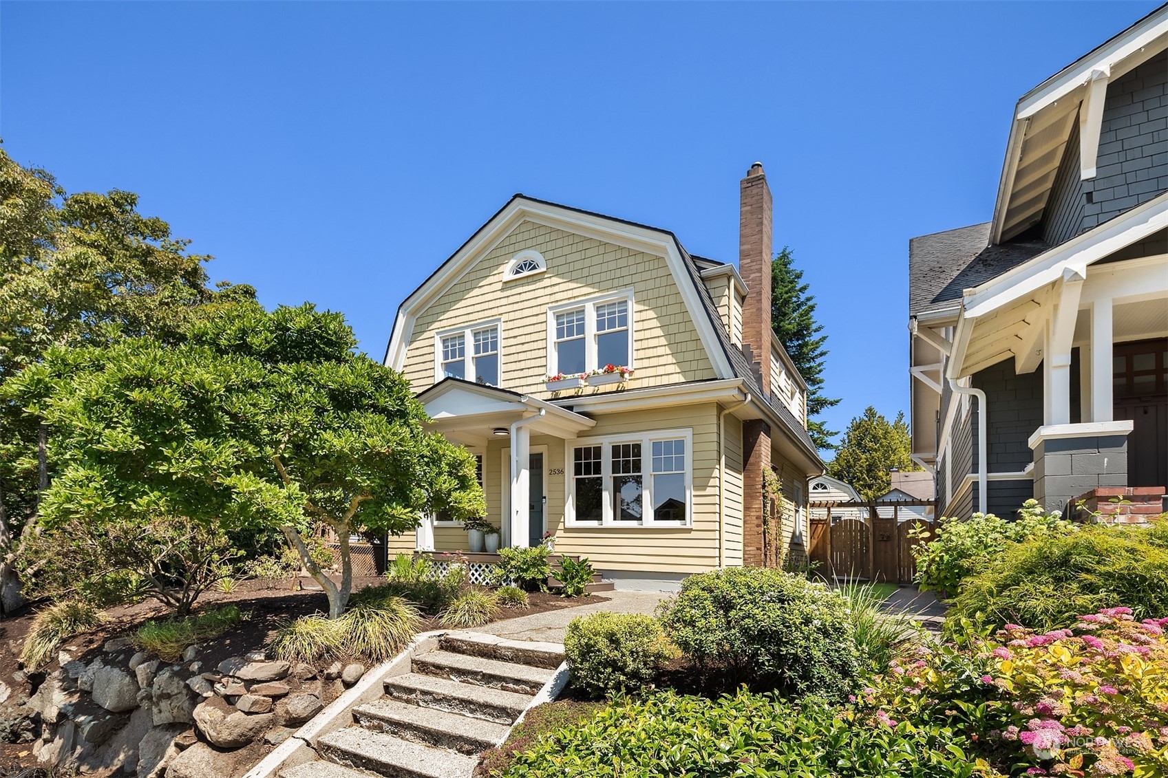 2536 1st Avenue West Seattle, WA 98119 - Photo 27 of 27 a front view of a house with a yard