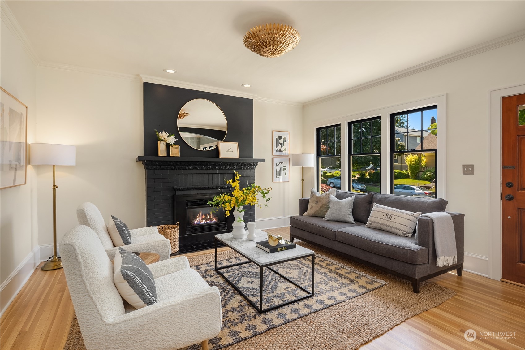 2536 1st Avenue West Seattle, WA 98119 - Photo 8 of 27 a living room with furniture a window and a fireplace