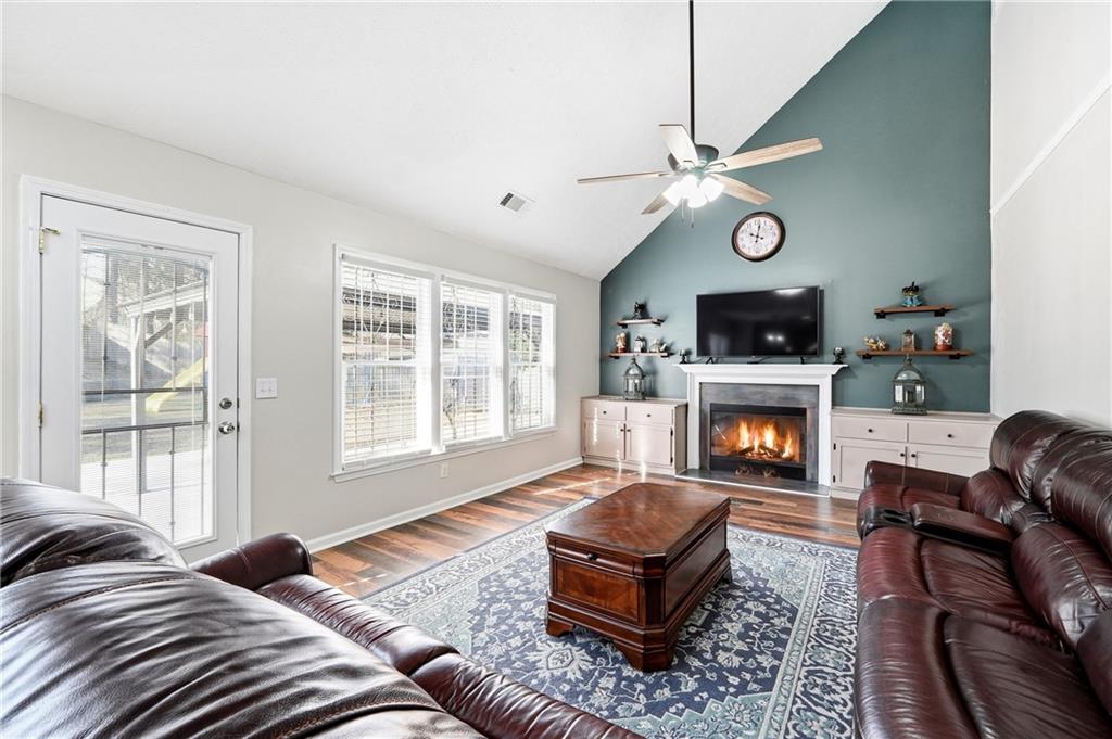 2964 Abbotts Oak Way Duluth, GA 30097 - Photo 12 of 29 a living room with furniture fireplace and a window